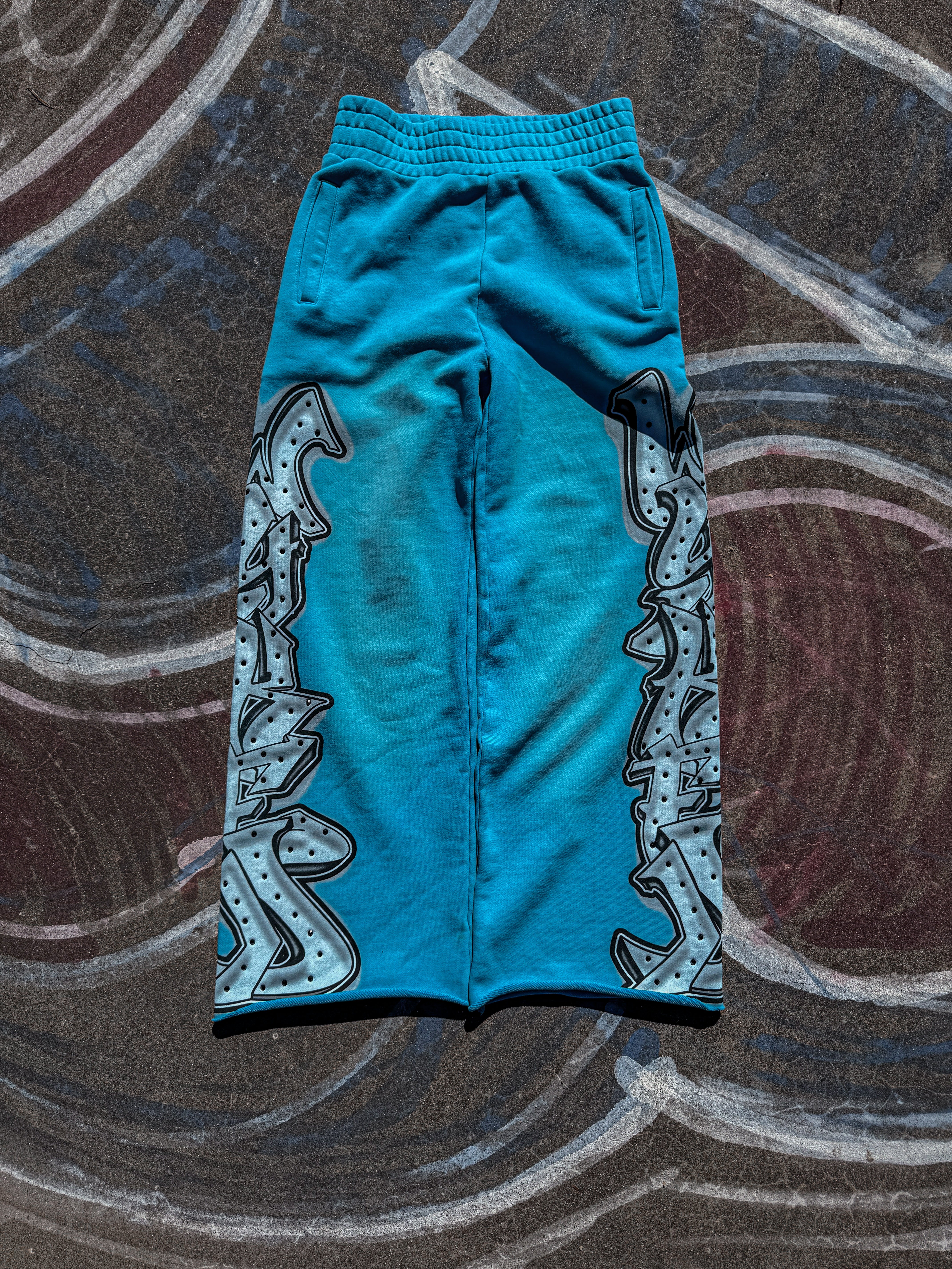 “GRAFFITI” BAGGY SWEATS AQUA