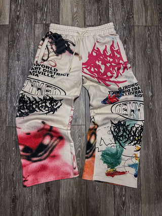 Graffiti printed wide-leg sweatpants with colorful designs and oversized fit for a trendy streetwear look.